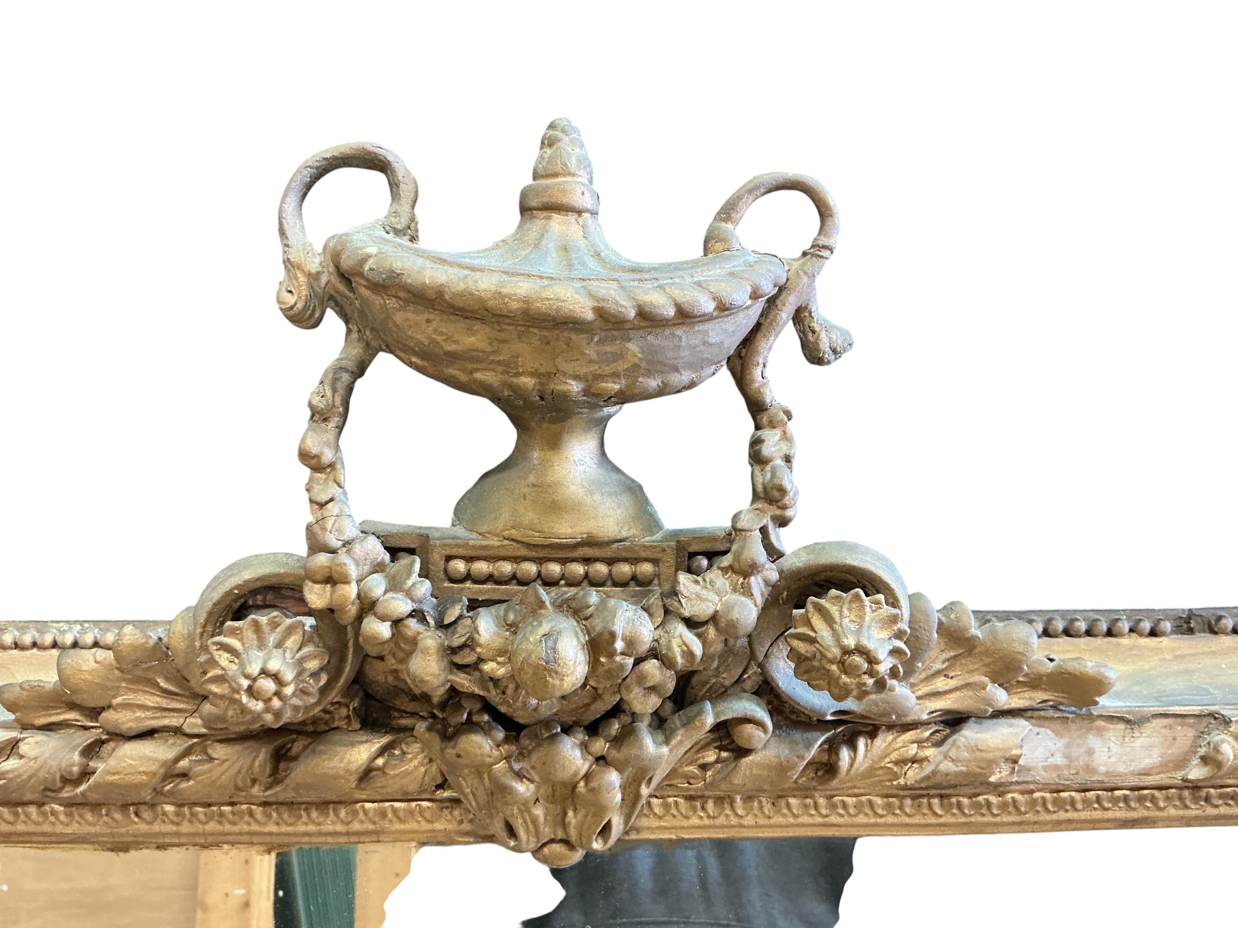 A Victorian giltwood and composition overmantel mirror, width 136cm, height 144cm